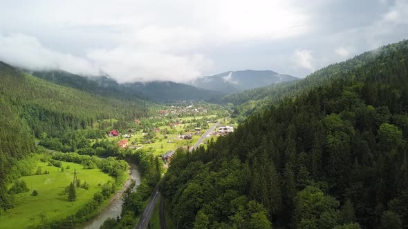 Aerial view of green Carpathian mountains covered with evergreen spruce pine foreston alt