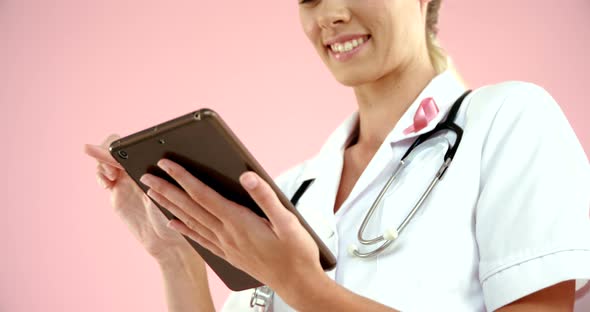 Doctor using digital tablet alt