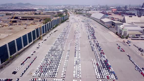 Aerial view of logistics concept of commercial vehicles, cars and pickup trucks waiting to be load o alt