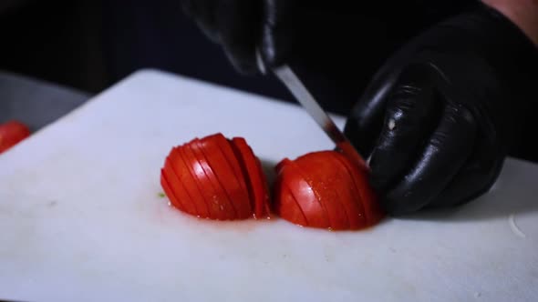 Slicing Tomato in Kitchen