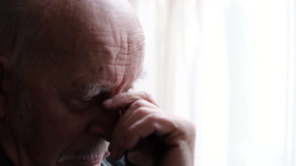 The Old Bald Man Has a Headache He is in Despair and Depression alt