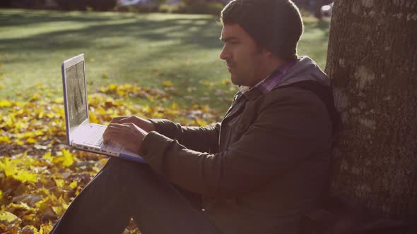 College student on campus using laptop computer