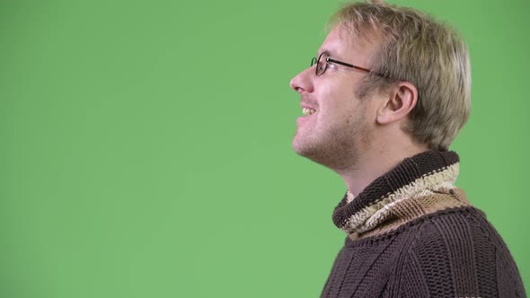 Head Shot Profile View of Happy Handsome Man Looking Up alt