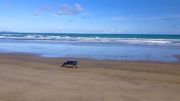 Aerial footage of driving on the beach alt