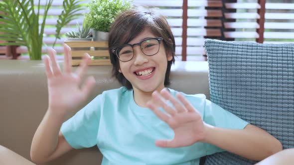 happiness asian child boy greeting hand wave to say hi  video portrait