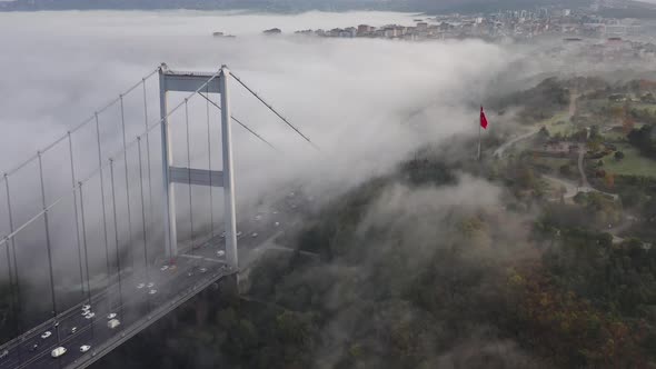 aerial video of Fatih Sultan Mehmet Bridge on a foggy day in Istanbul, Turkey alt