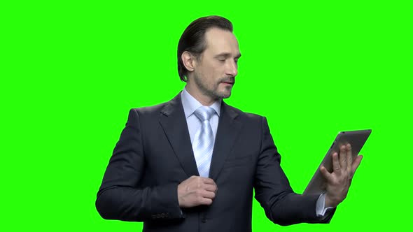 Businessman Talking with Tablet alt