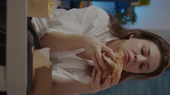 Vertical Video Adult with Takeaway Order of Fast Food Watching Television alt