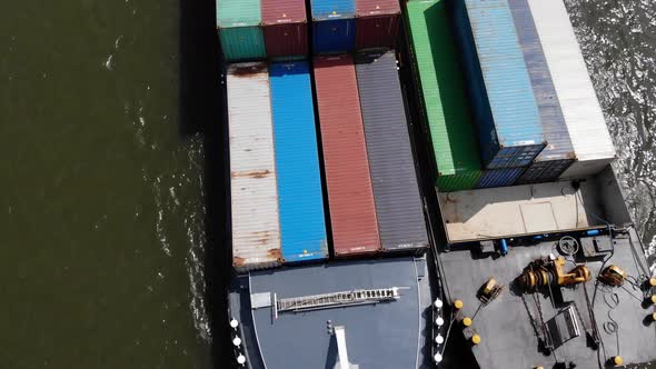 two barges attached to each other sailing on dutch waterway alt