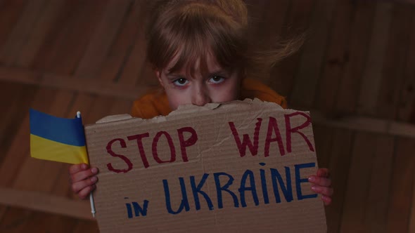 Scared Ukrainian Girl Inscription Massage Stop War In Ukraine Hiding From Bombing Attack at Home alt