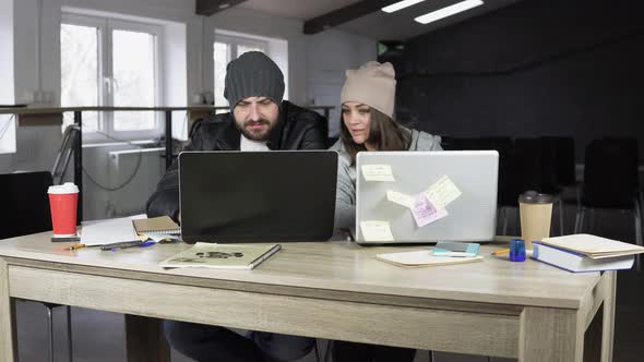 Young Man and Woman Working in Creative Office alt