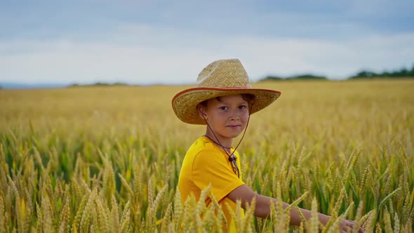 Little farmer outdoors. alt