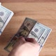 Person counts hundred dollar bills by throwing them on table, exchange rate, finance and business. - VideoHive Item for Sale