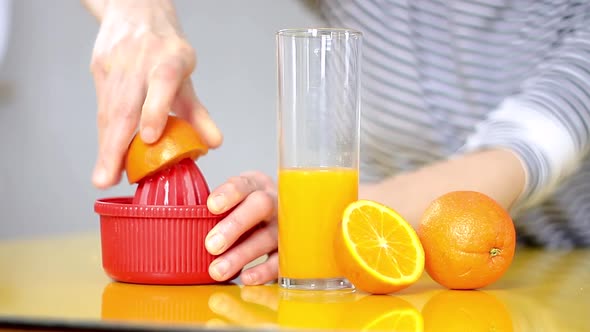 freshly squeezed orange juice in a glass on a table stock video stock footage alt