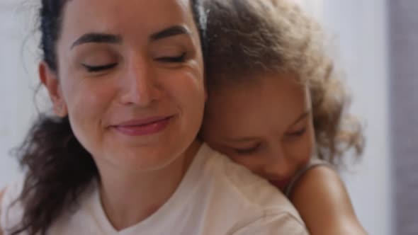 Happy Family Concept. Cute Affectionate Daughter Adopted Little Child Baby Girl Hugs Parent's Mother alt