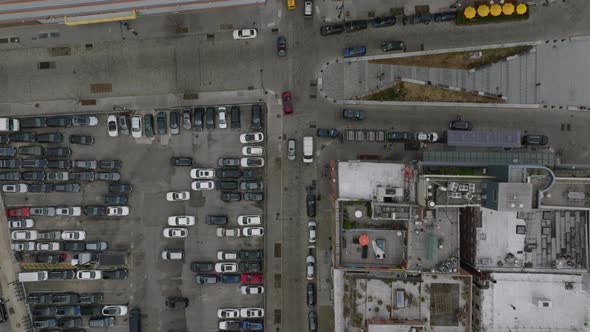 Top Down Panning Footage of Streets and Multistorey Buildings in City District alt