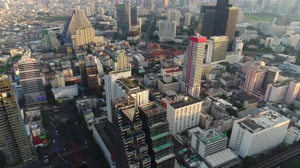 4k Aerial city view of Bangkok dowtnown, Flying over Bangkok, Thailand. alt