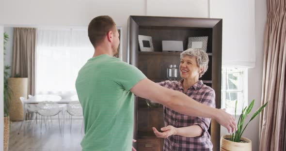 Mother and son hugging each other alt
