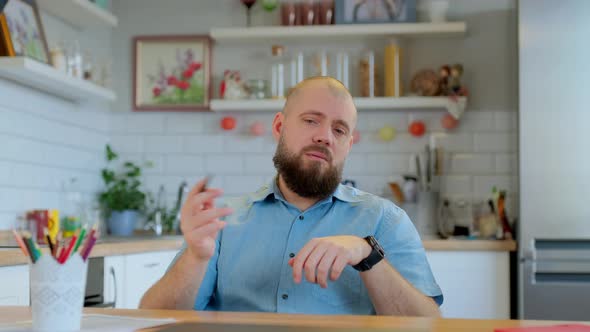 Mature Bearded Man Looking at Camera Webcam Consulting a Colleague Conference Video Call Ecoaching alt