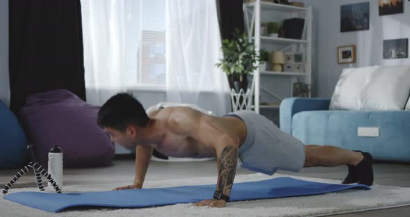 Young Man Working Out at Home alt