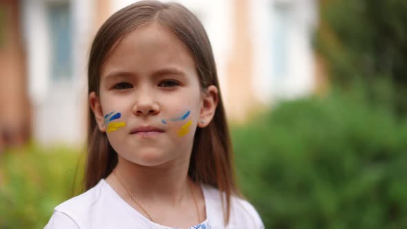 Closeup Ukrainian Girl with Serious Facial Expression Turning Looking at Camera in Slow Motion alt