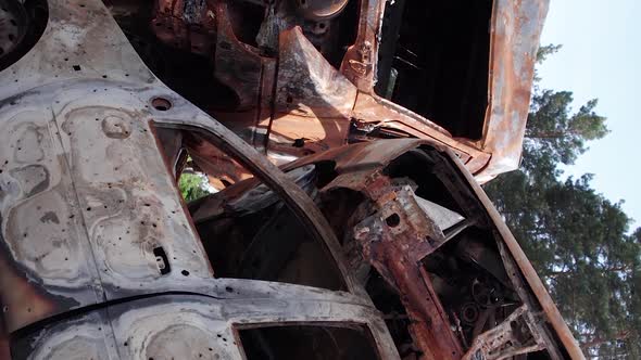 Vertical Video of Wardestroyed Cars in Irpin Ukraine alt