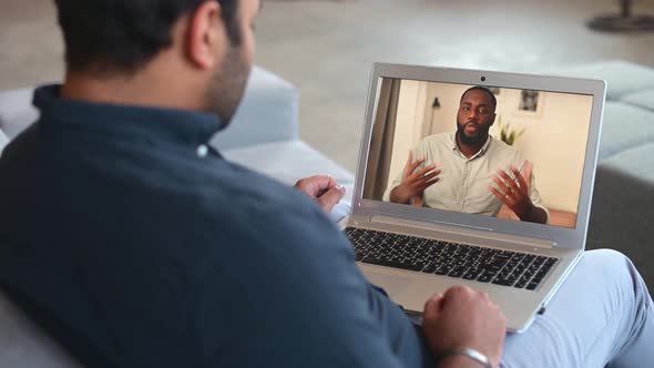 Back Rear View Focused Young Indian Male Employee Working From Home alt