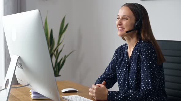 Woman is Using Headset for Online Communication alt