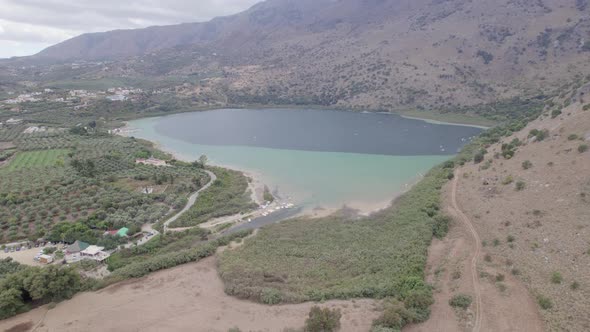 Aerial view of the lake among mountain cliffs. The landscape of Green canyon alt