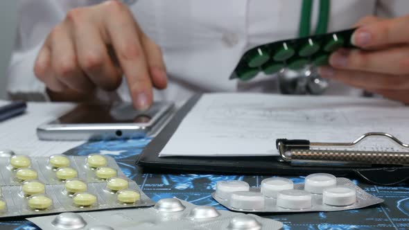 Female Doctor Uses A Smartphone And Prescribes A Prescription For Tablets alt