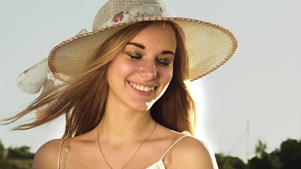 Teenager in the Background of a Landscape Poses for Cameras. Slow Motion alt