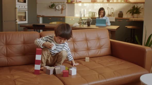 Funny Asian Baby Boy with Educational Toy Blocks alt