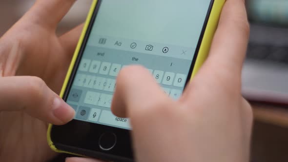 Female Types Text on Phone Closeup Sends a Message Makes a Plan for the Day