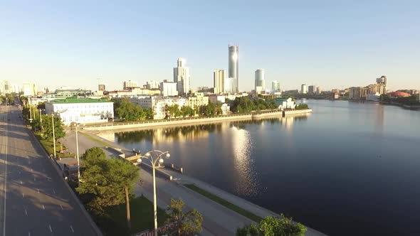 Ekaterinburg city. Lenin Avenue and pond on the river Iset. Aerial, summer, sunny alt