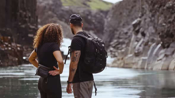 Base of the Studlagil Canyon's Riverside and Tourists Enjoying the Scenery alt