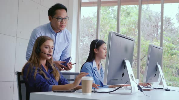 Customer Support Agent or Call Center with Headset Talking to Customer on Phone alt