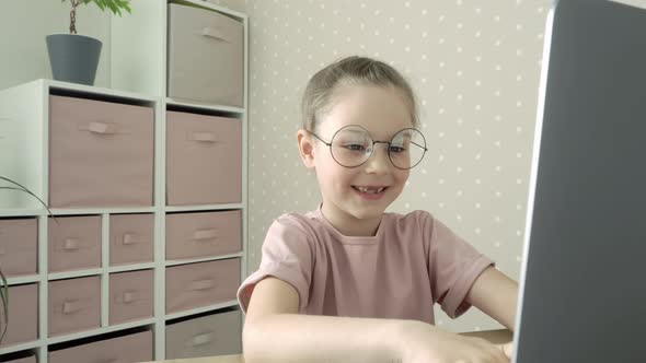 Schoolgirl Uses Laptop