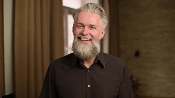 Emotion of embarrassment and embarrassment shown by a gray-haired adult man alt