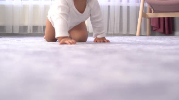 Smiling and crawling baby. alt