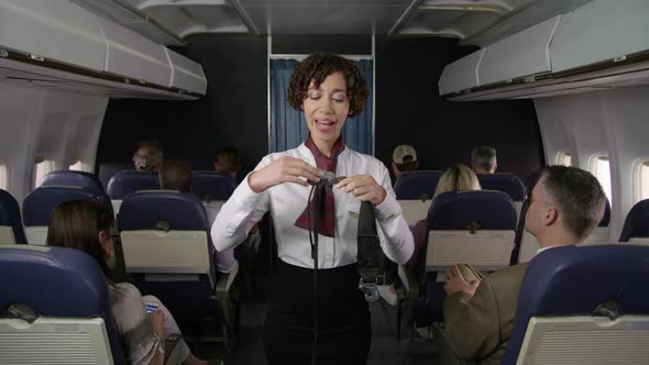 Airliner flight attendant explaining safety rules
