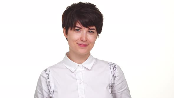 Caucasian Female Flirting in Front of Camera Isolated Over White Background Closeup alt