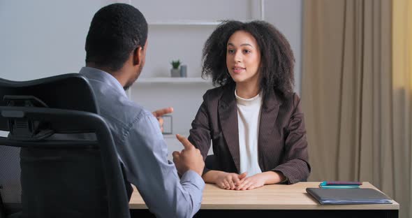 Two People Colleagues Afro American Businesswoman and Ethnic Businessmen Boss Emotionally Discuss alt
