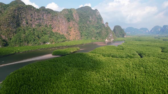 Drone flying over Ao Thalane mangroves and river in Krabi Thailand on a sunny day overlooking the mo alt