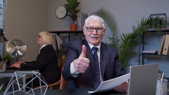 Cheerful Senior Manager Showing Thumbs Up Approval Gesture Satisfied with Good Results of Work alt