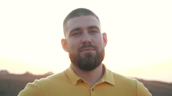 Close Up, Portrait of a Handsome Caucasian Bearded Young Man Looking Straight To the Camera on the alt