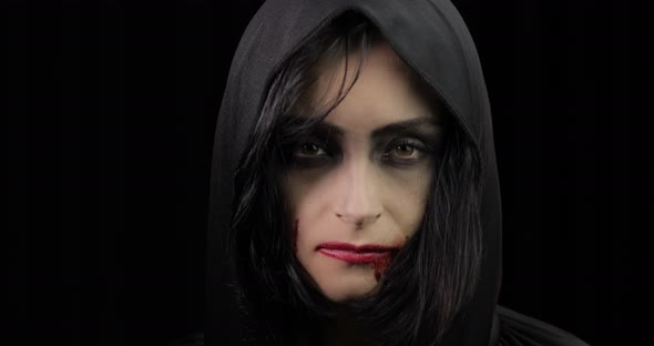 Vampire Halloween Makeup. Woman Portrait with Blood on Her Face. alt