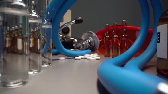 Macro Video of Doctor's Office Working Table with Stethoscope and Medicines