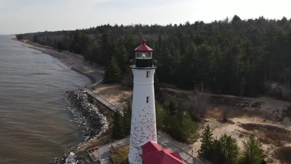 4k drone video of Crisp Point Lighthouse in Michigan during the fall. alt