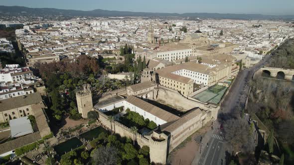 Aerial circling view of Roman bridge and Mezquita-Cathedral in Cordoba in Spain