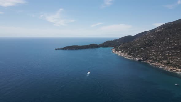 Aerial view of a boat sailing along the coast, Elba Island, Tuscany, Italy. alt